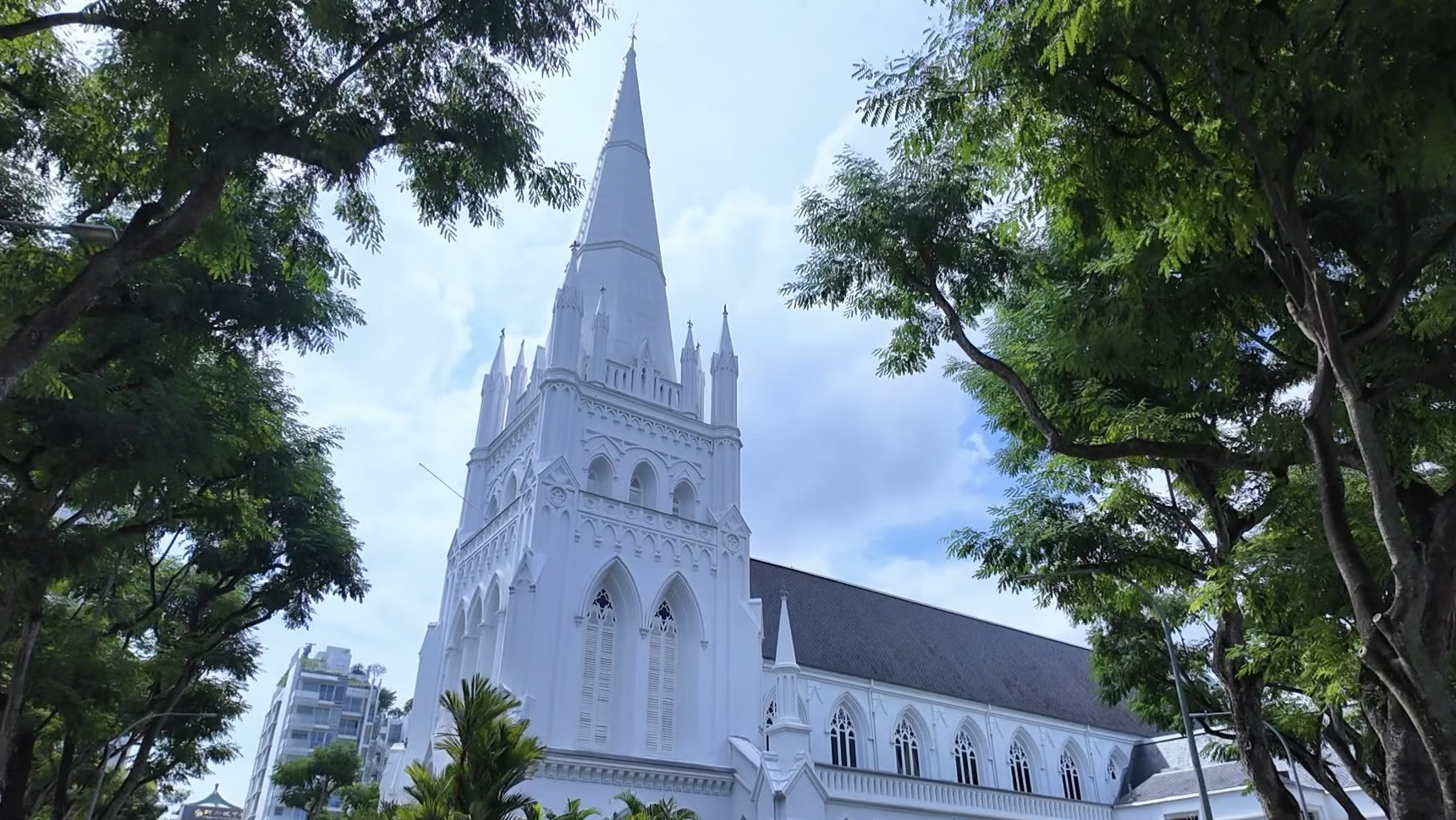 St. Andrew's Cathedral surrounded by greenery in Singapore